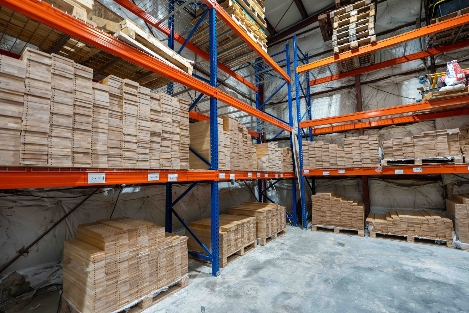 This image shows an inventory of FL Drawers, high quality wood panels stacked on top of each other. 