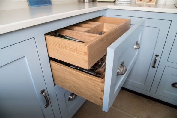 This image shows a beautiful dovetailed drawer in a kitchen. 